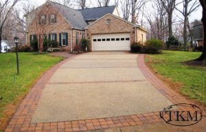 Exposed aggregate driveway with paver accents